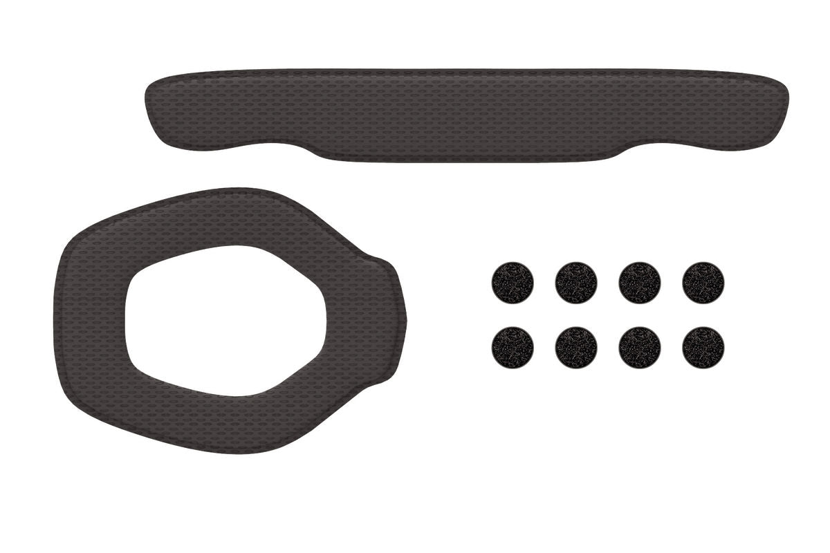 Set of black rubber gaskets and washers on a white background