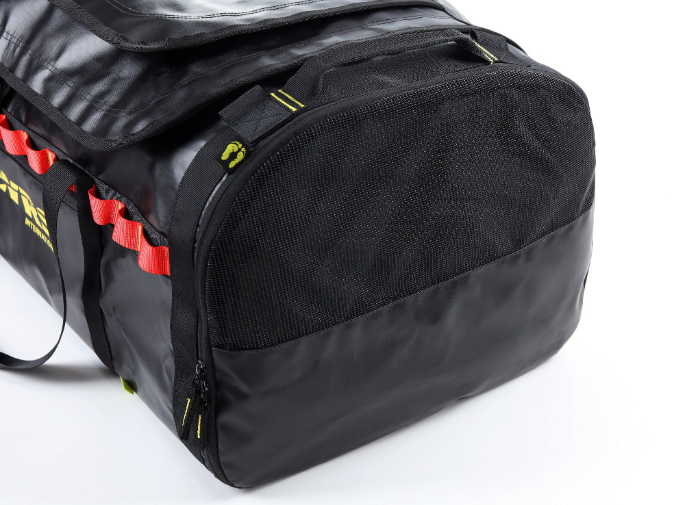 Black duffel bag with red accents on a white background