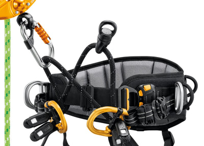 Black and orange climbing harness with carabiners on a white background