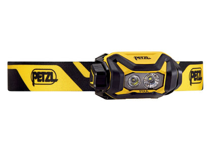 Yellow and black Petzl headlamp on a white background