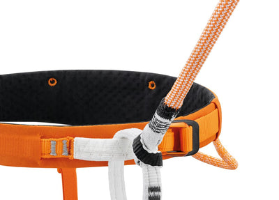 Orange climbing harness with a rope on a white background