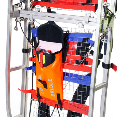 Orange lift bridle with black cap on a metal stand against a white background
