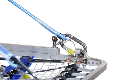 Close-up of a mechanical component with blue cables on a white background
