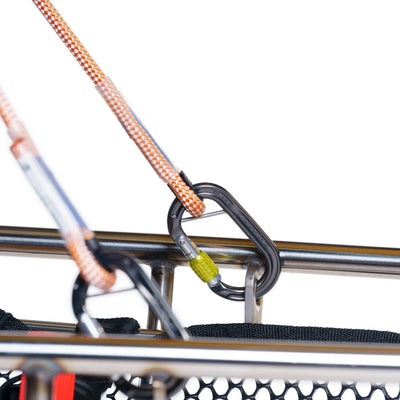 Close-up of a bike rack with straps and metal hooks on a white background