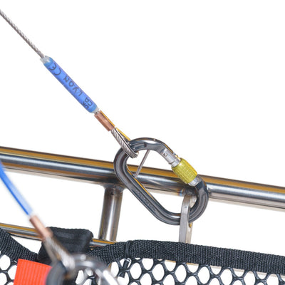 Close-up of a metal frame with ropes and a carabiner on a white background