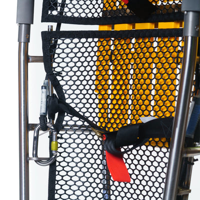Close-up of a mesh bag with a yellow pattern and black straps on a white background