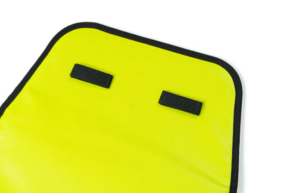 Yellow knee pad with black straps on a white background