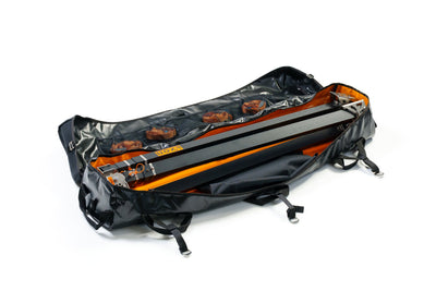 Black and orange backpack with clear plastic cover on a white background