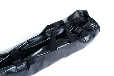 Black waterproof bag with straps on a white background
