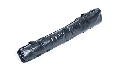 Black foam roller on a white background