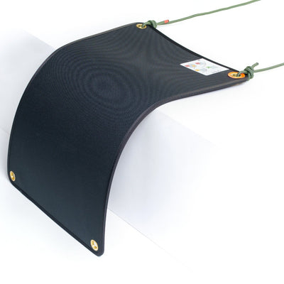 Black curved fabric panel with gold buttons on a white background
