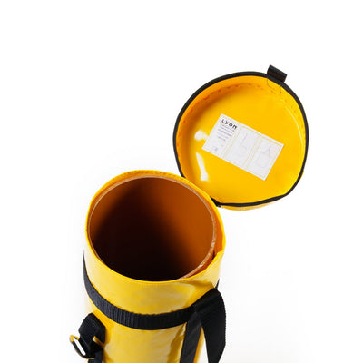 Yellow cylindrical bag with a black strap on a white background