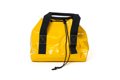 Yellow bag with black straps on a white background