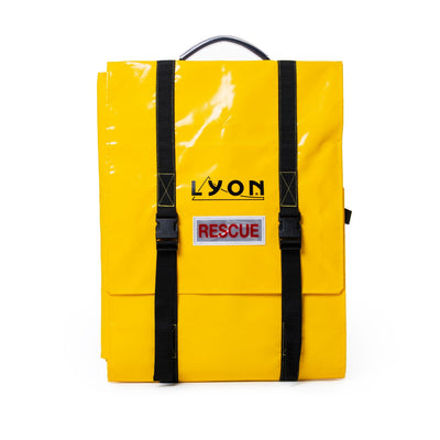 Yellow bag with black straps and 'LYON RESCUE' label on a white background