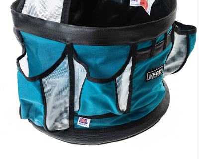 Teal pet carrier with black mesh sides on a white background