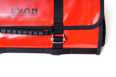 Red bag with black strap and 'LYON' branding on a white background