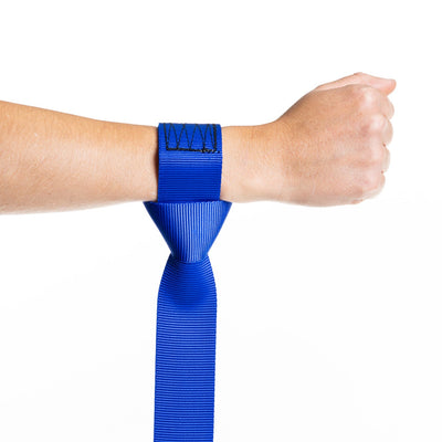 Person wearing a blue wrist wrap on a white background