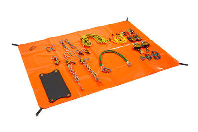 Orange mat with various climbing equipment on a white background
