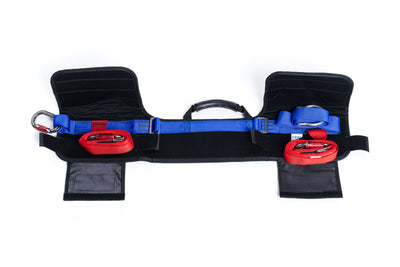 Safety harness with black straps and red and blue connectors on a white background