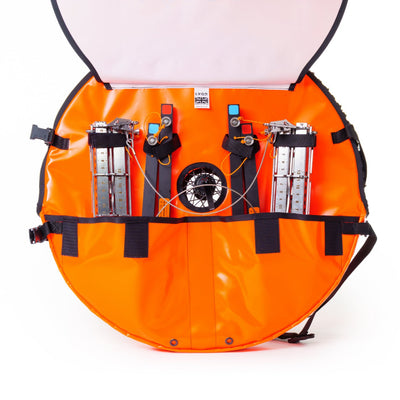 Orange bag with various compartments and equipment on a white background