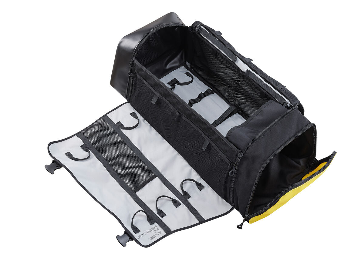 Black tool bag with rolled-up tools on a white background