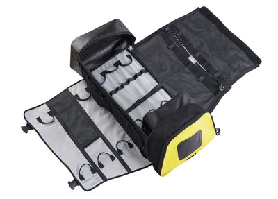 Black and yellow tool roll with tools on a white background